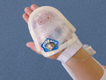 750LFP I.V. House UltraDome on toddler's hand