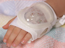 730S I.V. House UltraDressing on child's hand